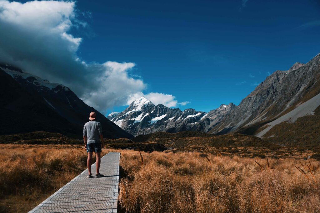 Man viewing snow covered mountain